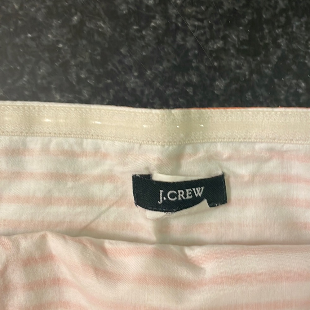 J.Crew size small orange and white halter top with zipper closure on side.